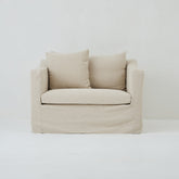 Front view of the Ayla Armchair in Beige Linen fabric loose linen cover